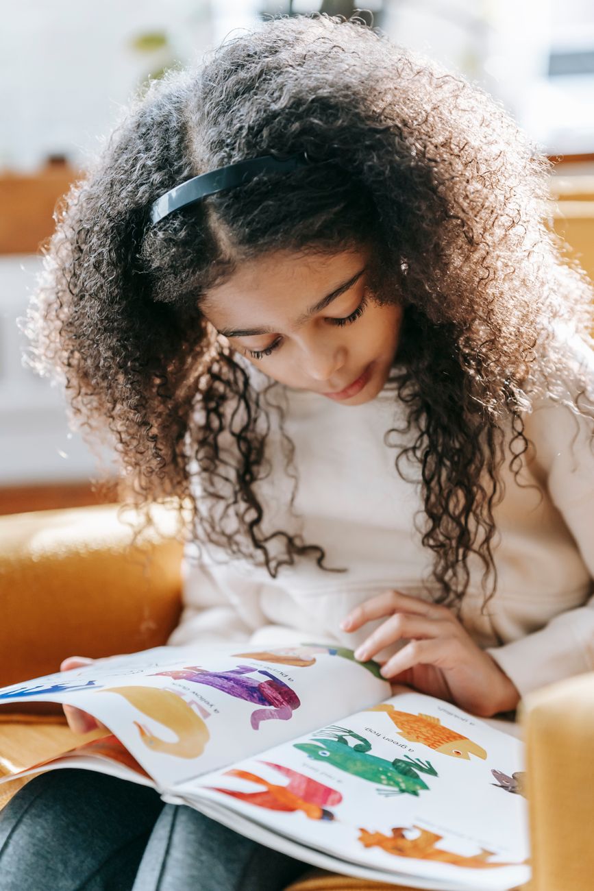 Girl reading a picture book